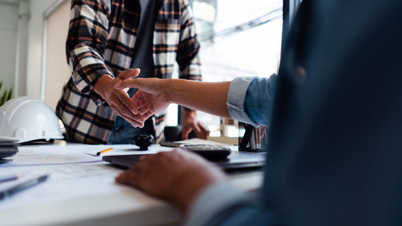 Photo showing two people shaking hands